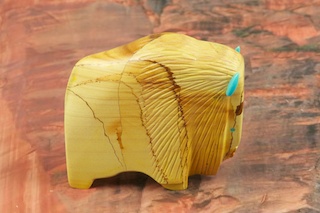 Zuni Buffalo Fetish created by Zuni Artist Gayle Lucio. Signed by the artist. Carved from Genuine Picture Jasper with Turquoise Eyes and Horns.